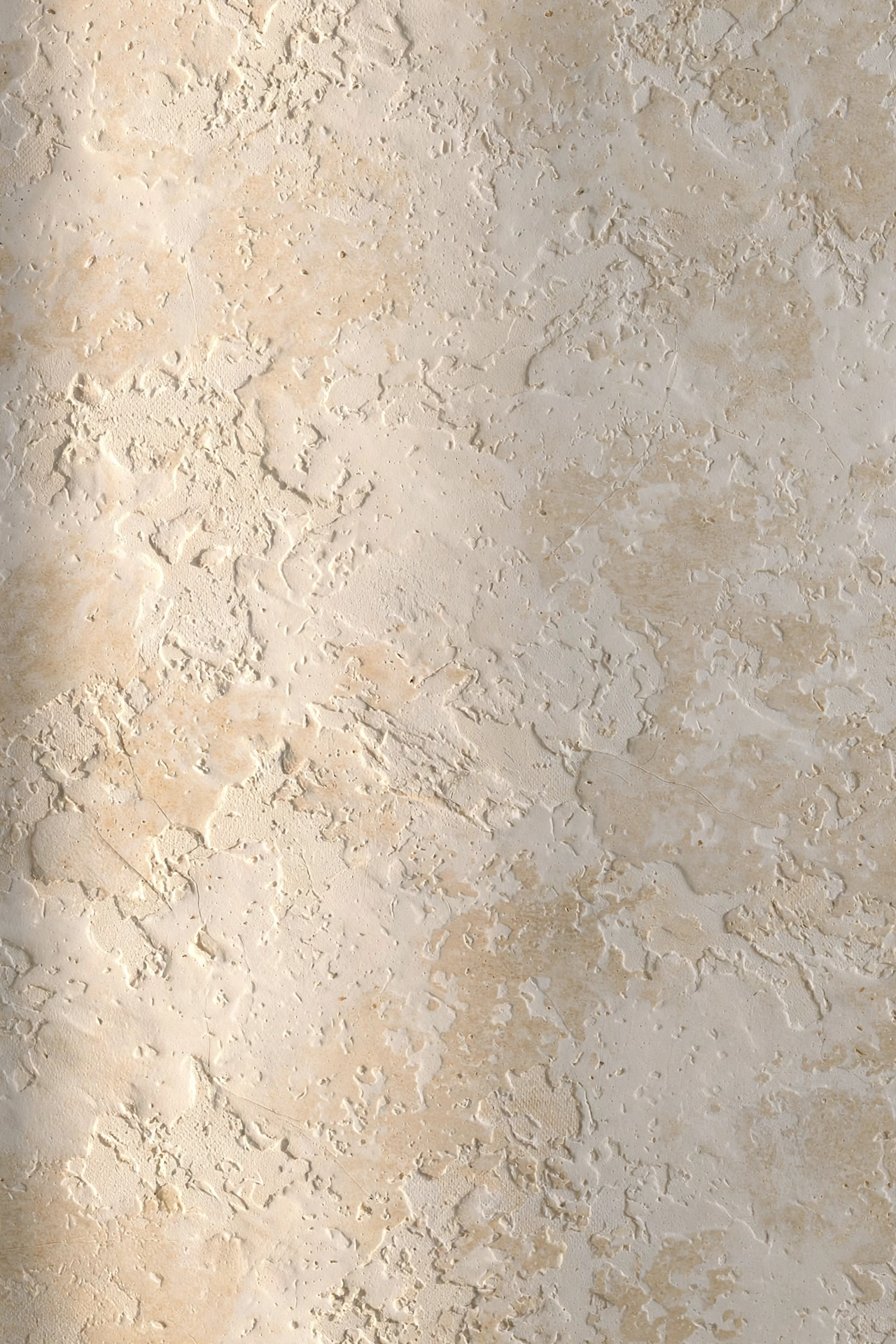 Close-up of a warm white limewash wall showing its cloudy mineral texture