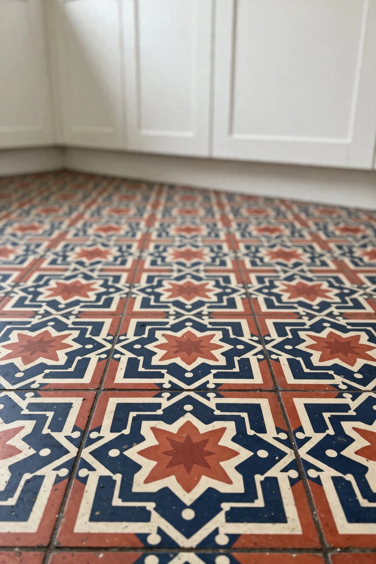 Patterned cement tile floor in a bright kitchen